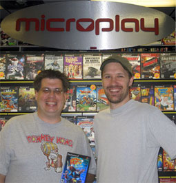 Syd Bolton with Microplay manager Chris after buying his one-thousandth PlayStation 2 game